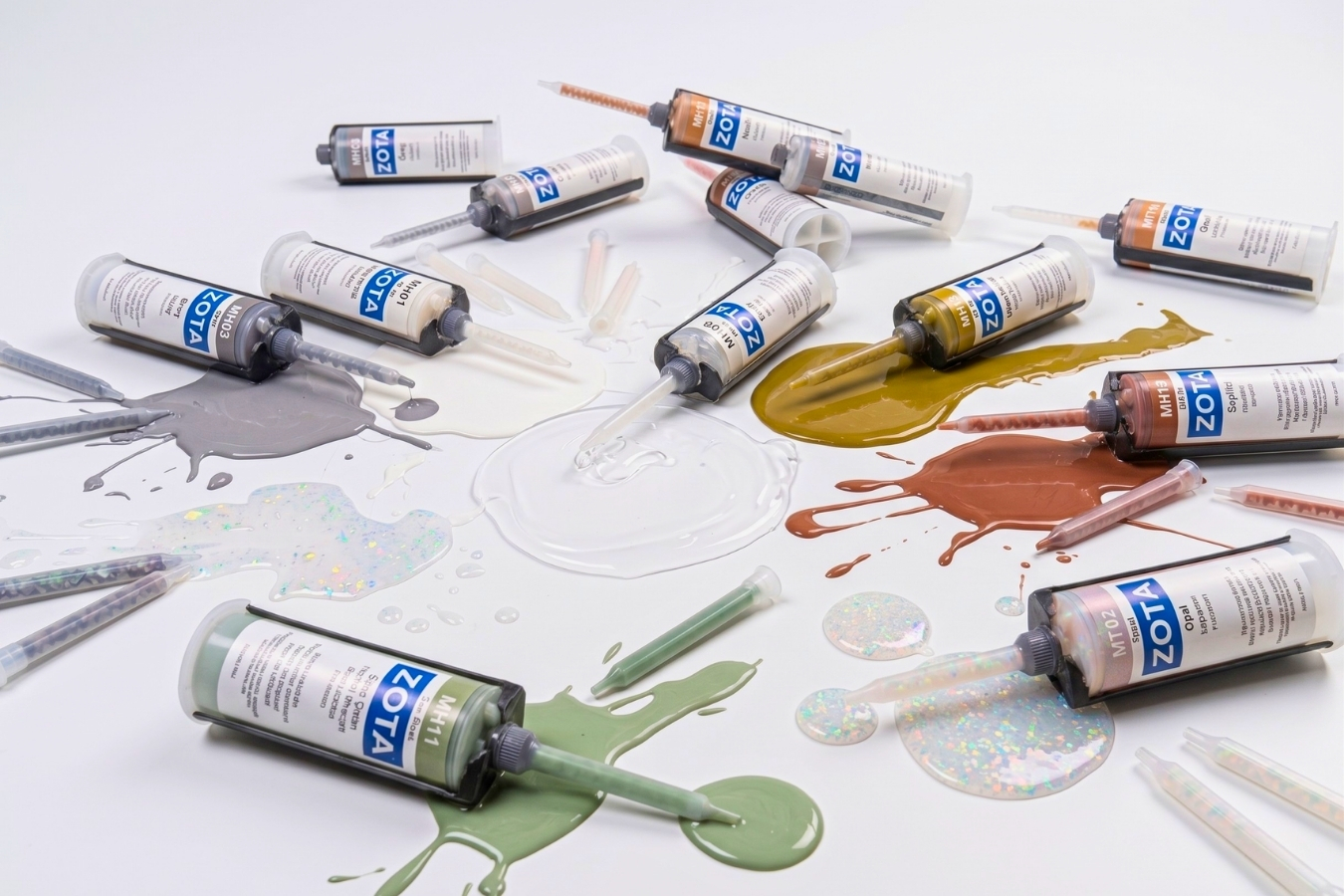 A variety of ZOTA color-matched adhesives for solid surface and quartz; showcasing Marktec’s range of glue shades including grey, gold, sage green, and glitter finishes for seamless countertop seams.